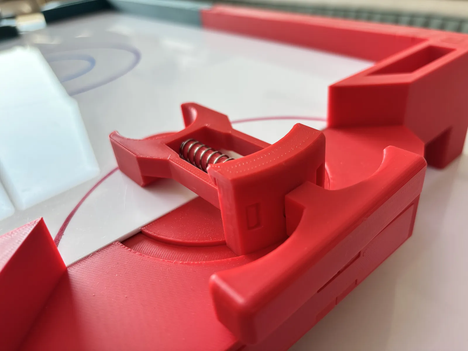 Close-up of the red curling-game launcher