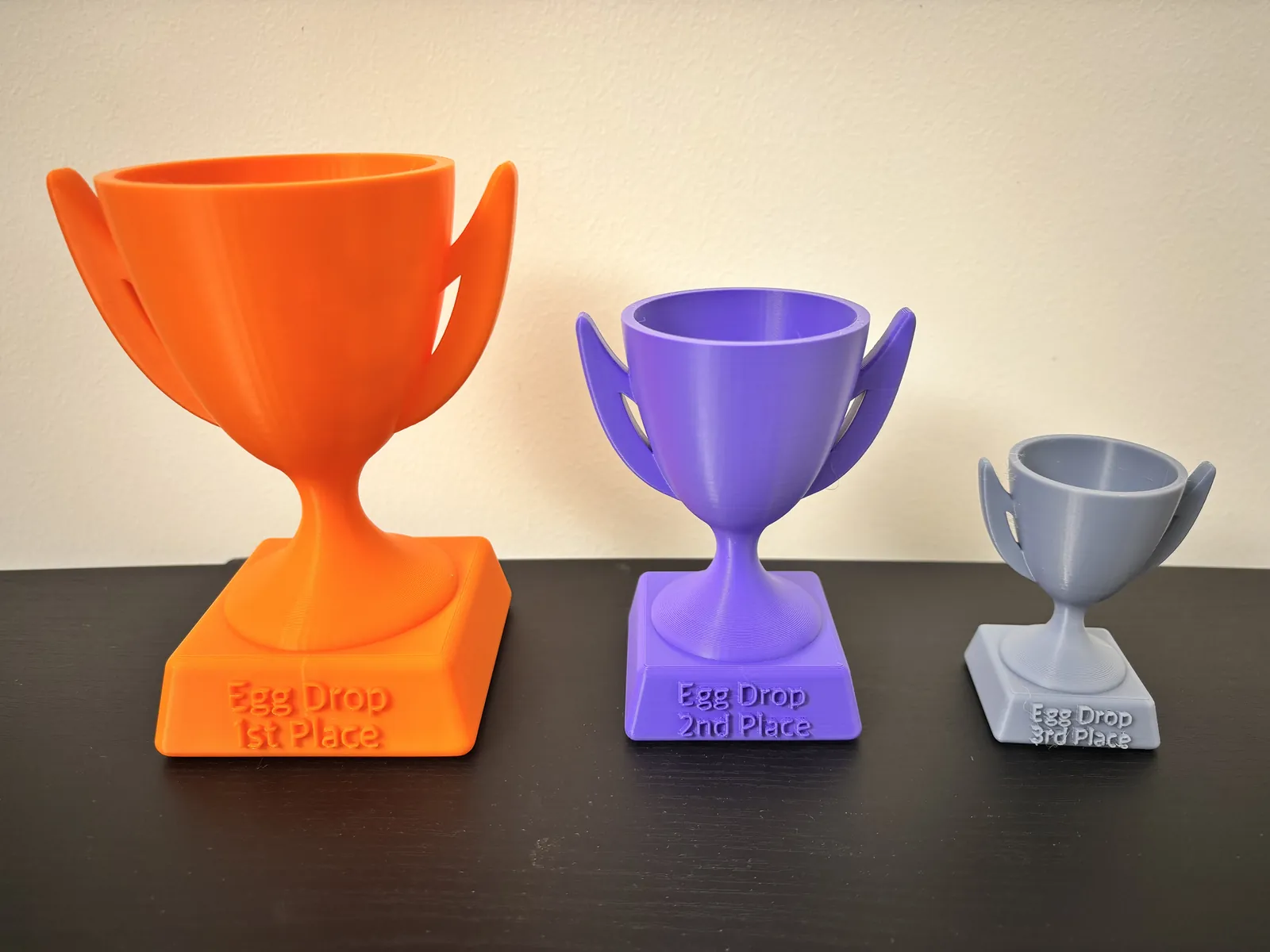Three custom 3D-printed Egg Drop Competition trophies